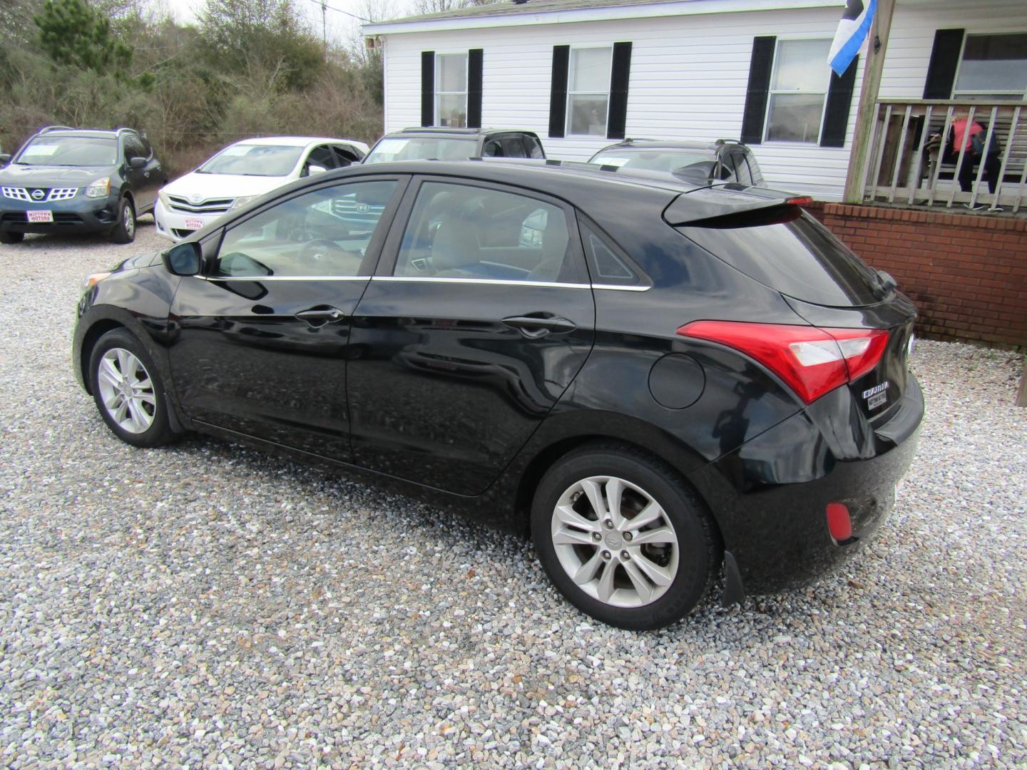 2013 Black Hyundai Elantra GT A/T (KMHD35LE1DU) with an 1.8L L4 16V DOHC engine, 6-Speed Automatic transmission, located at 15016 S Hwy 231, Midland City, AL, 36350, (334) 983-3001, 31.306210, -85.495277 - Photo#5